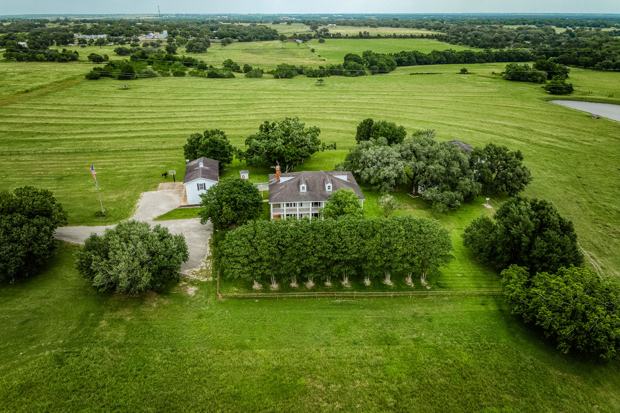 7023 Wolters Road Schulenburg, TX 78956 - Photo 5 of 49 an aerial view of a houses with outdoor space and city view
