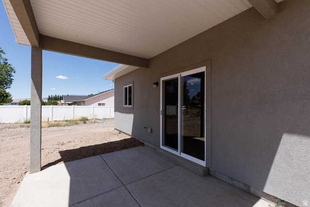 51 West 500 South Monroe, UT 84754 - Photo 26 of 41 Covered patio featuring a concrete slab and stucco finish