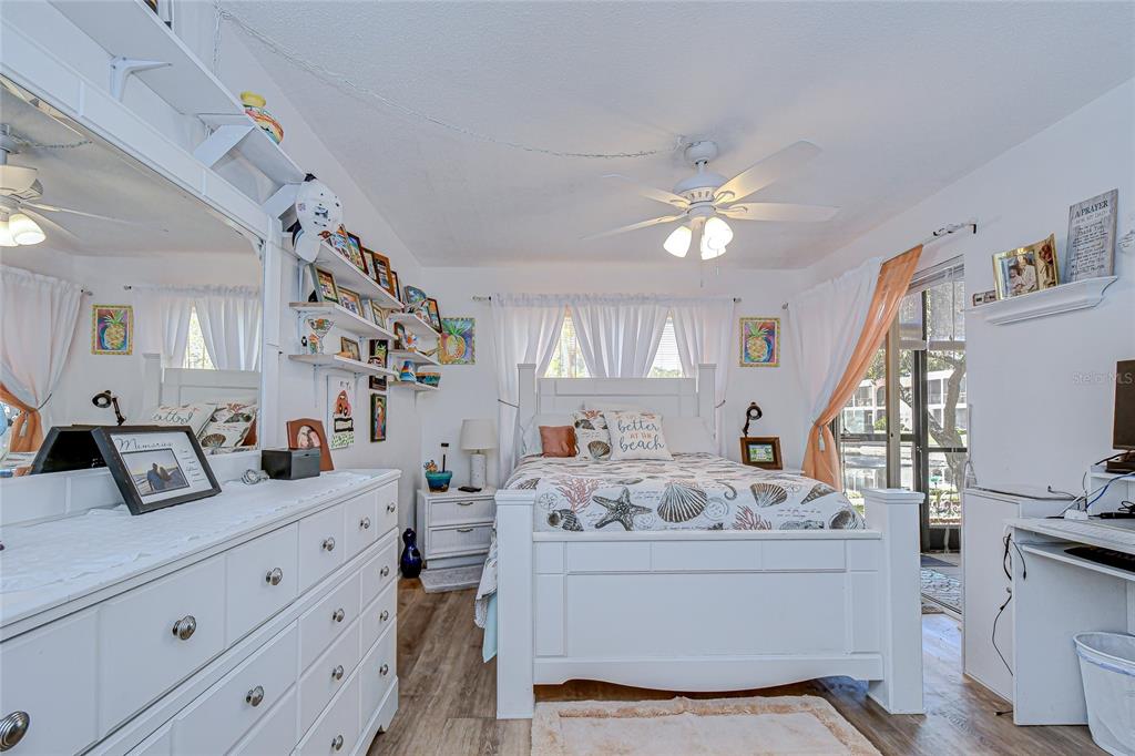 9700 Starkey Road, Unit 111 Seminole, FL 33777 - Photo 20 of 46 a living room with furniture and wooden floor