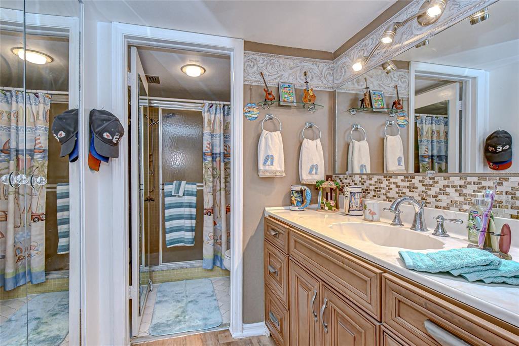 9700 Starkey Road, Unit 111 Seminole, FL 33777 - Photo 21 of 46 a bathroom with a sink and a mirror