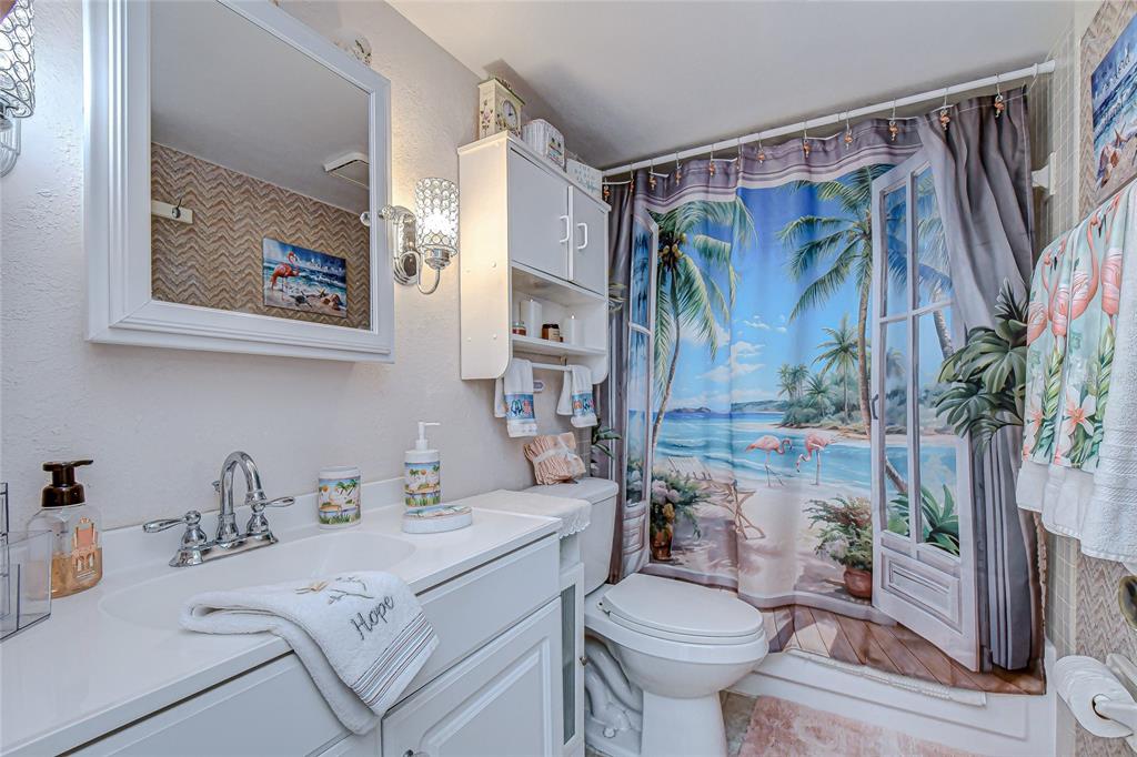 9700 Starkey Road, Unit 111 Seminole, FL 33777 - Photo 24 of 46 a bathroom with a sink toilet and shower