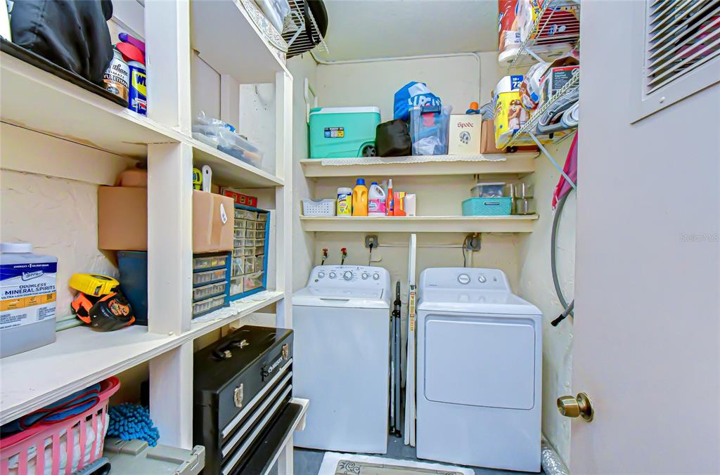 9700 Starkey Road, Unit 111 Seminole, FL 33777 - Photo 28 of 46 a room with storage and utility