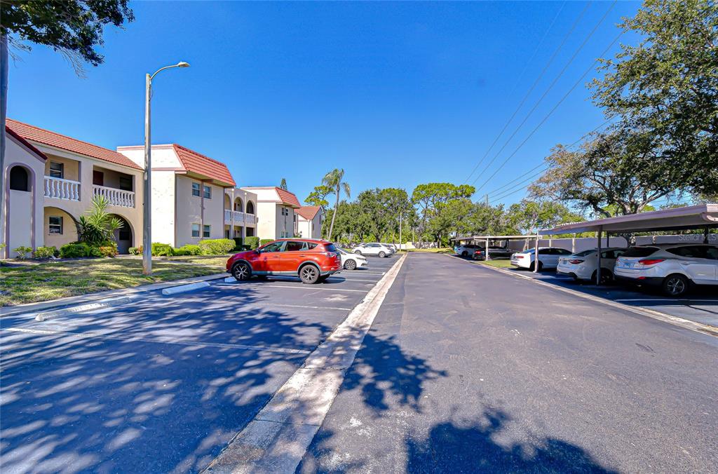 9700 Starkey Road, Unit 111 Seminole, FL 33777 - Photo 3 of 46 a view of street with cars