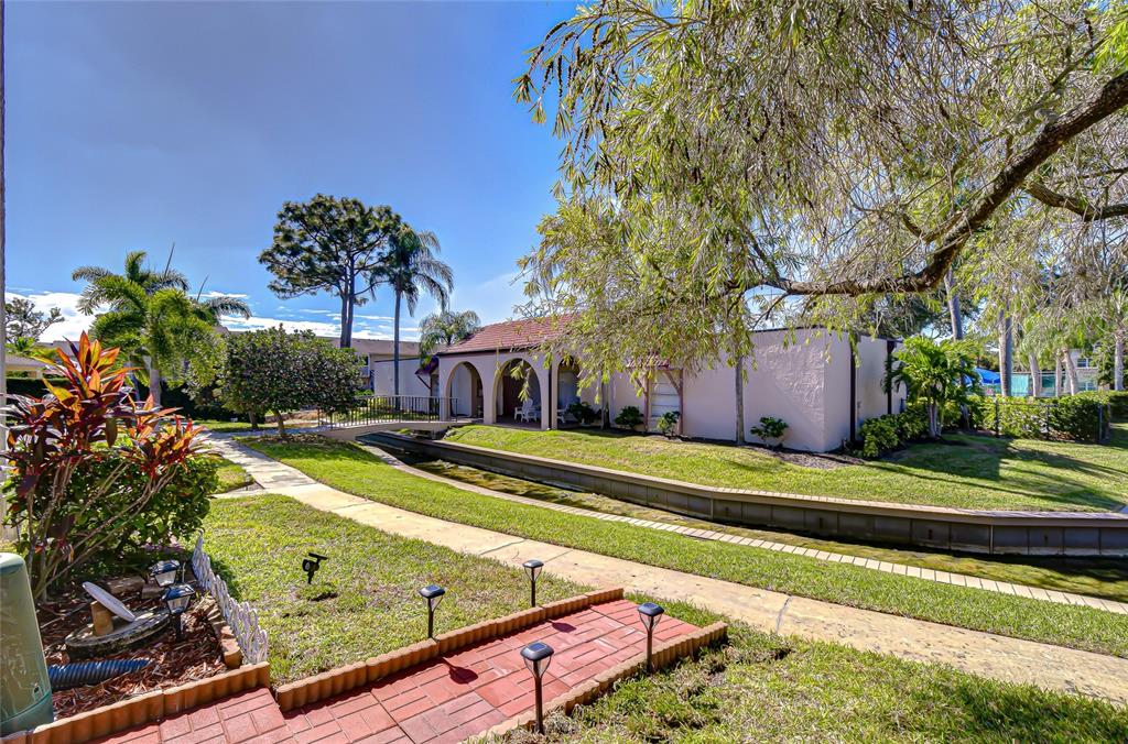 9700 Starkey Road, Unit 111 Seminole, FL 33777 - Photo 31 of 46 a view of a house with a swimming pool