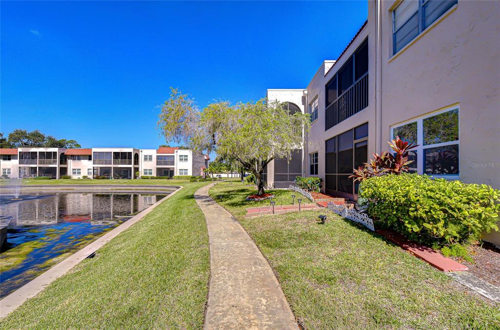 9700 Starkey Road, Unit 111 Seminole, FL 33777 - Photo 42 of 46 a view of a house with swimming pool