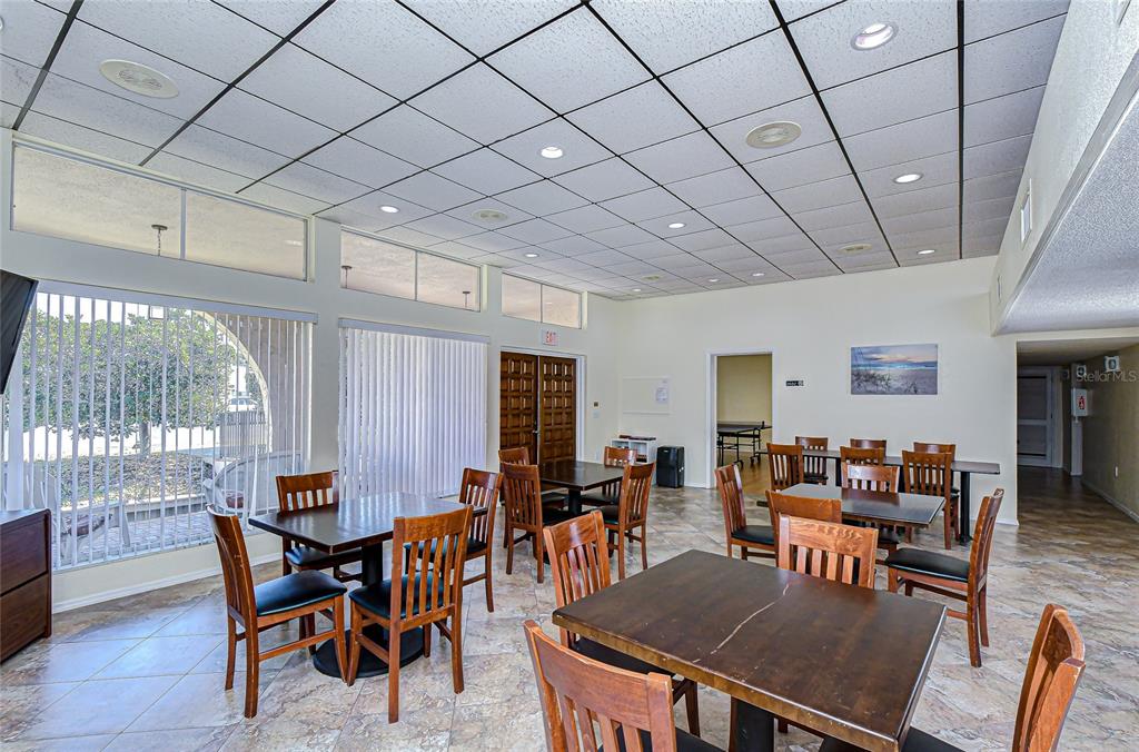 9700 Starkey Road, Unit 111 Seminole, FL 33777 - Photo 43 of 46 a view of a dining room with furniture window and wooden floor