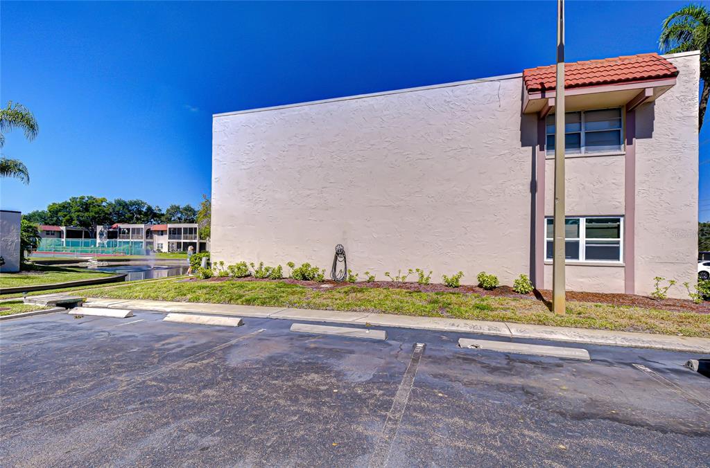 9700 Starkey Road, Unit 111 Seminole, FL 33777 - Photo 46 of 46 a view of swimming pool with a yard and sitting area