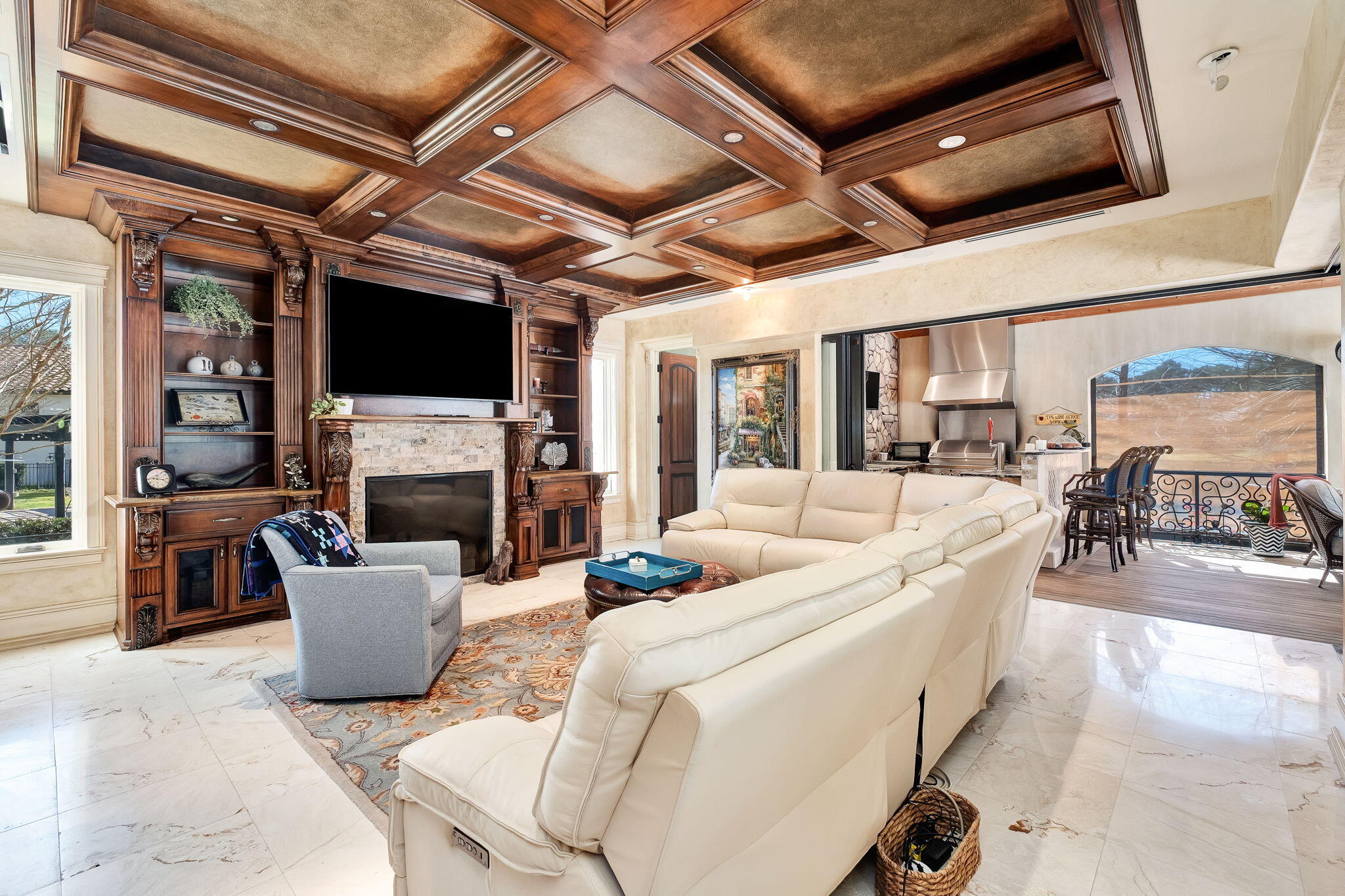 437 Admiral Court Destin, FL 32541 - Photo 44 of 100 a living room with furniture a fireplace and a flat screen tv