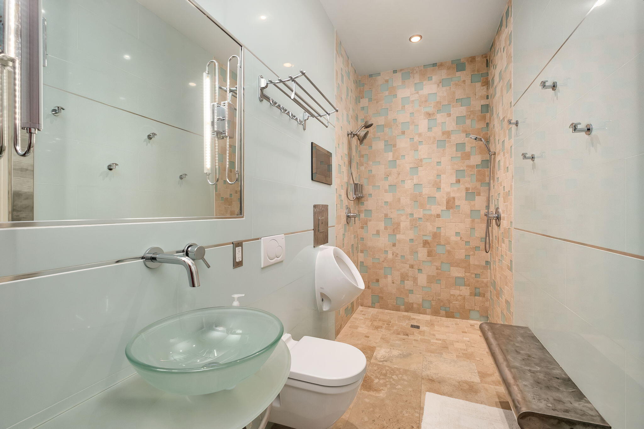 437 Admiral Court Destin, FL 32541 - Photo 63 of 100 a white toilet sitting next to a bathroom sink and a shower