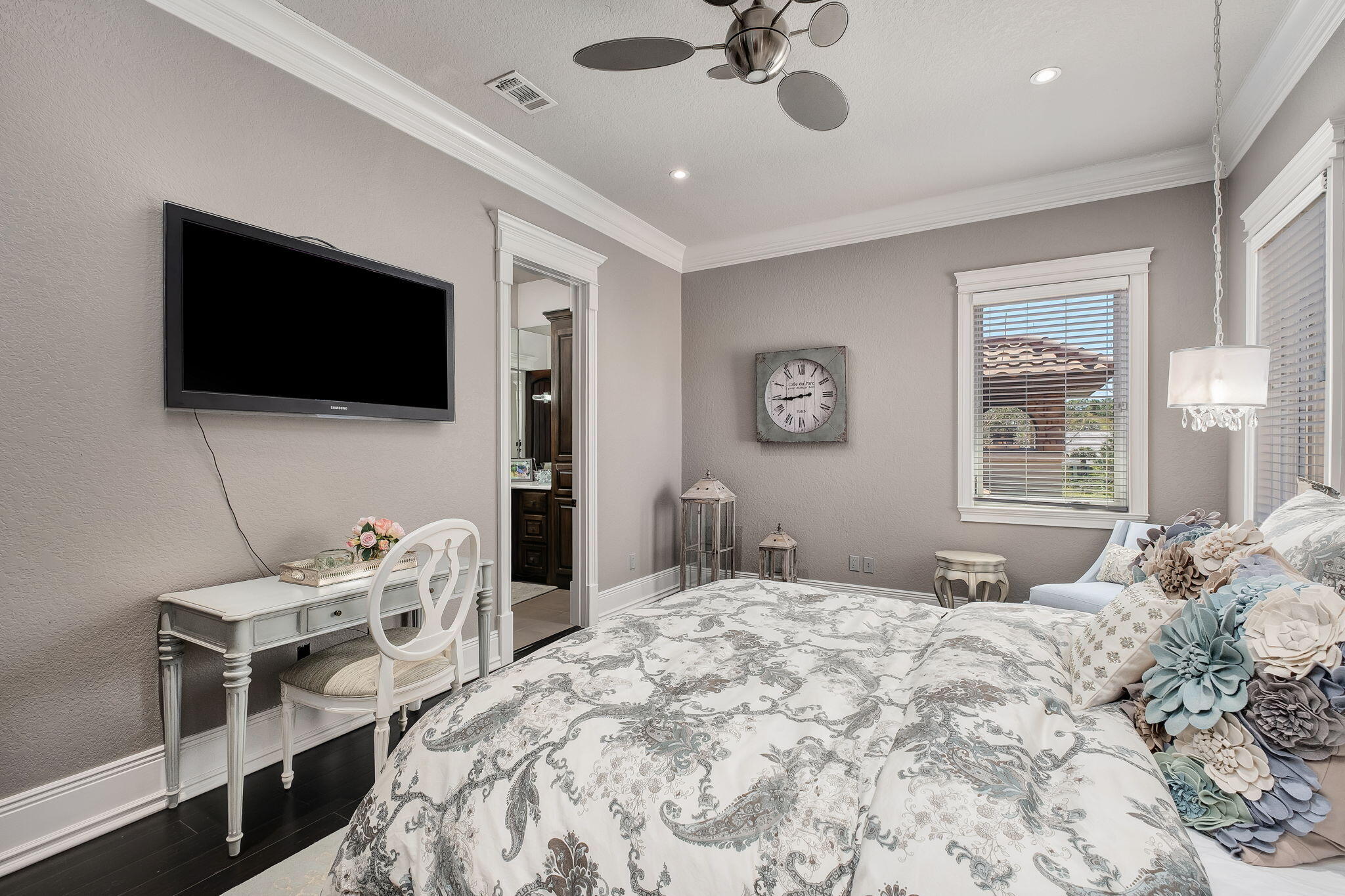 437 Admiral Court Destin, FL 32541 - Photo 77 of 100 a bedroom with a bed a flat screen tv and couches