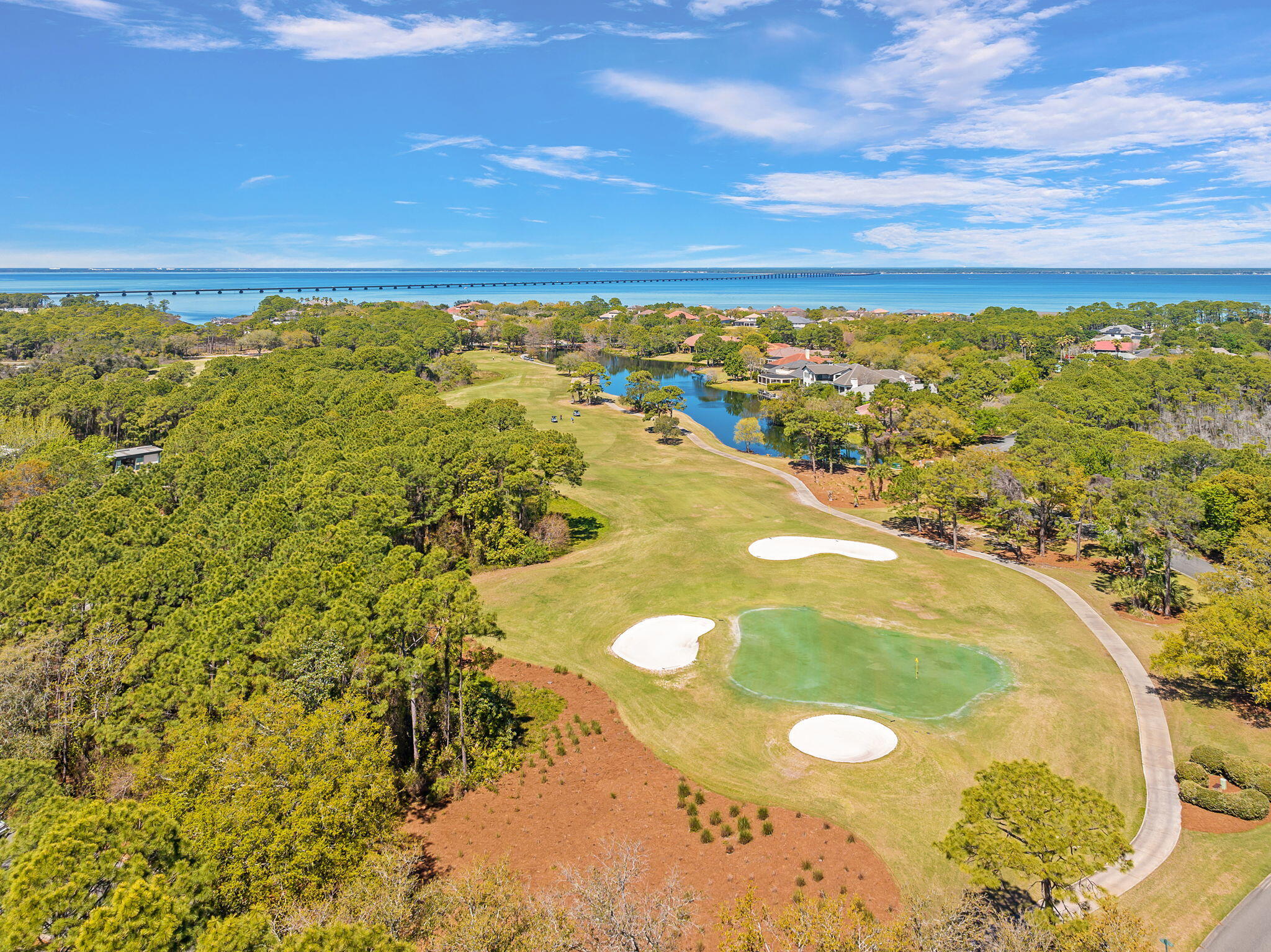 437 Admiral Court Destin, FL 32541 - Photo 93 of 100 a view of a swimming pool with an outdoor seating and a garden