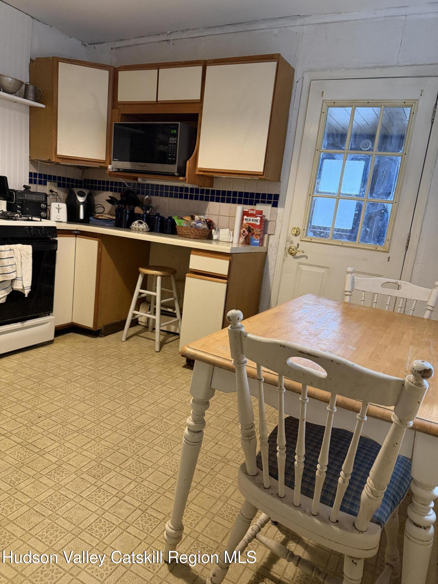 20 8th Street Hudson, NY 12534 - Photo 12 of 29 a kitchen with a stove and a microwave