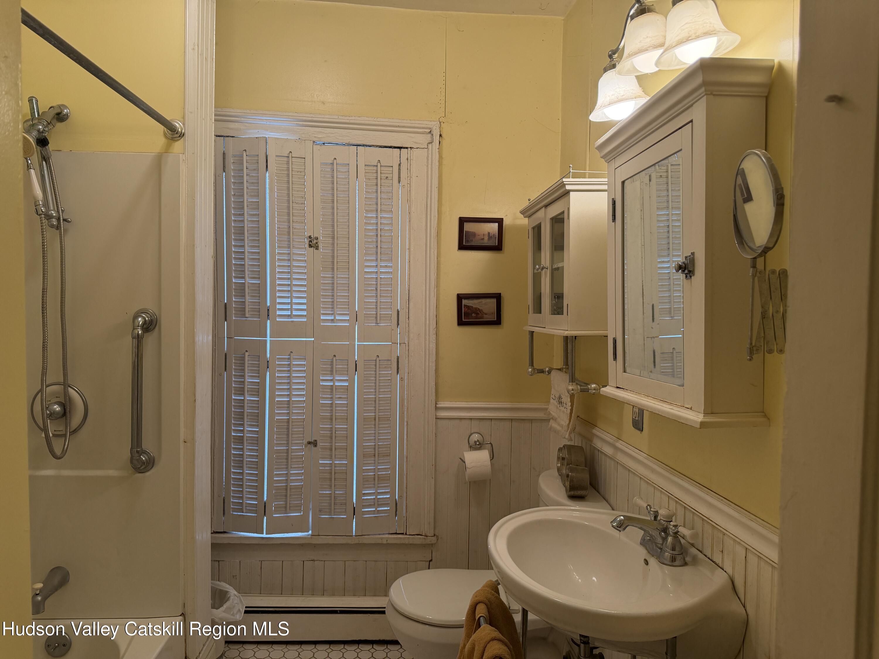 20 8th Street Hudson, NY 12534 - Photo 23 of 29 a bathroom with a sink toilet and shower