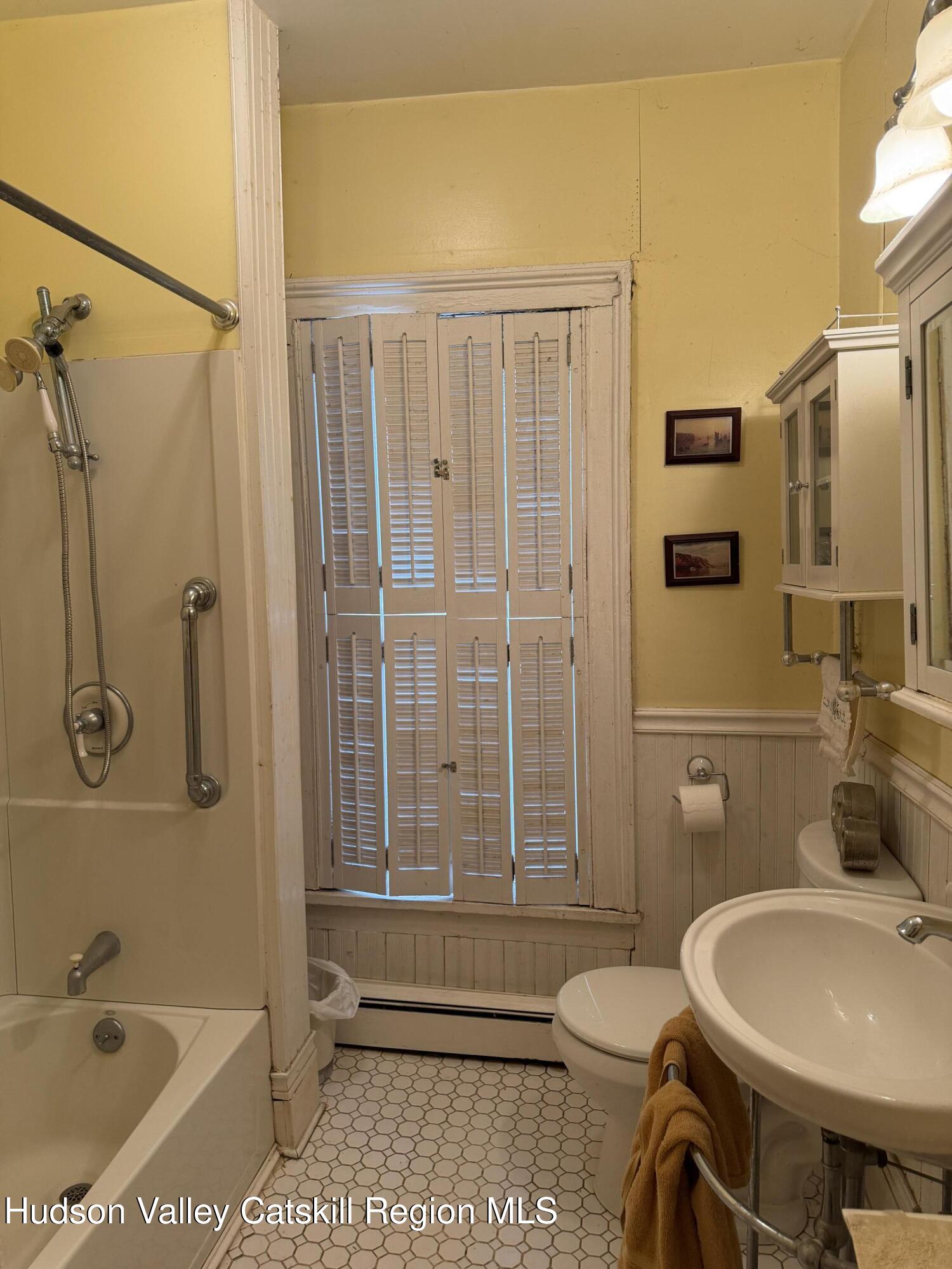 20 8th Street Hudson, NY 12534 - Photo 24 of 29 a bathroom with a toilet sink shower and bathtub