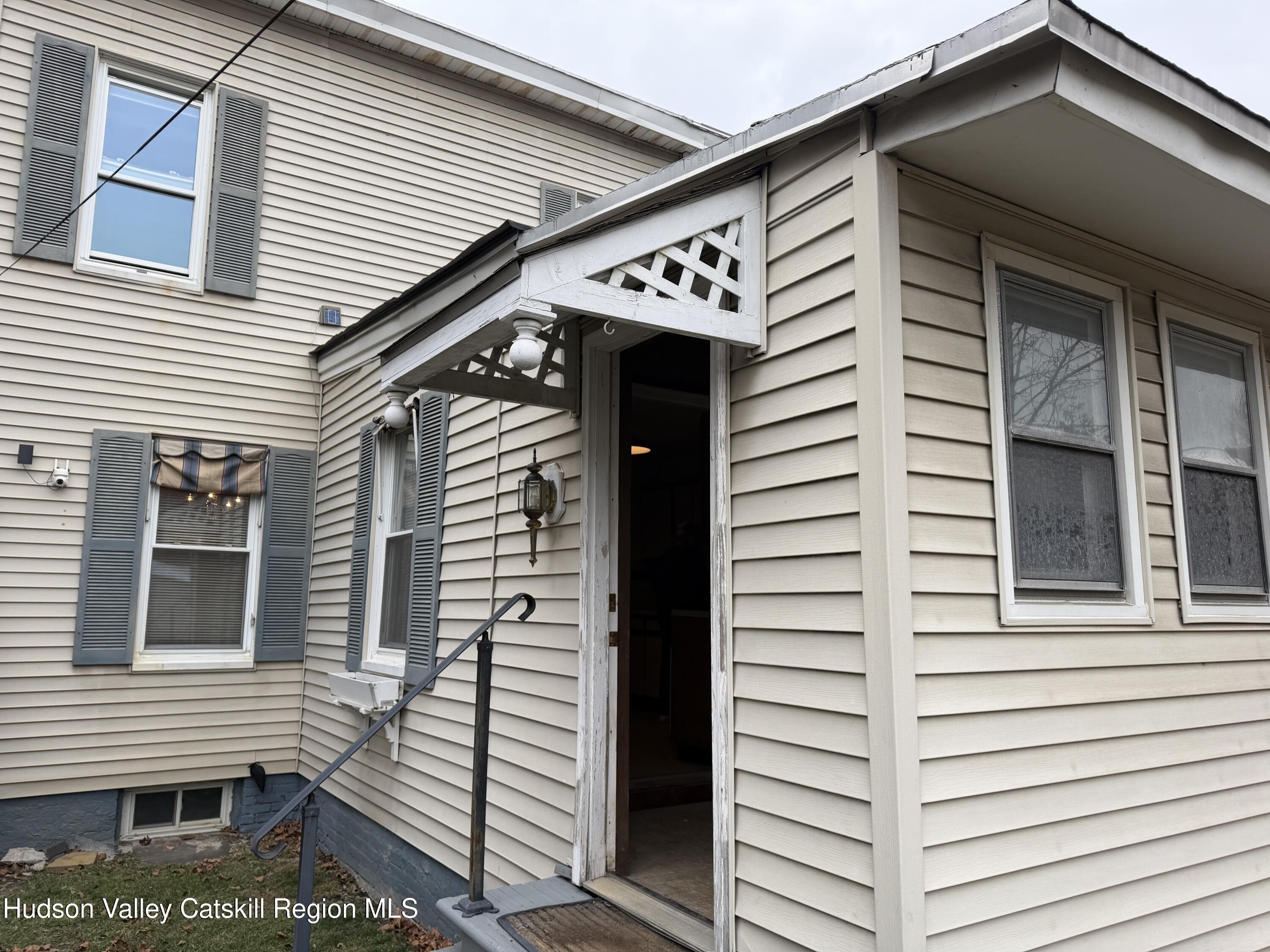 20 8th Street Hudson, NY 12534 - Photo 26 of 29 a view of a house with a door and wooden stairs