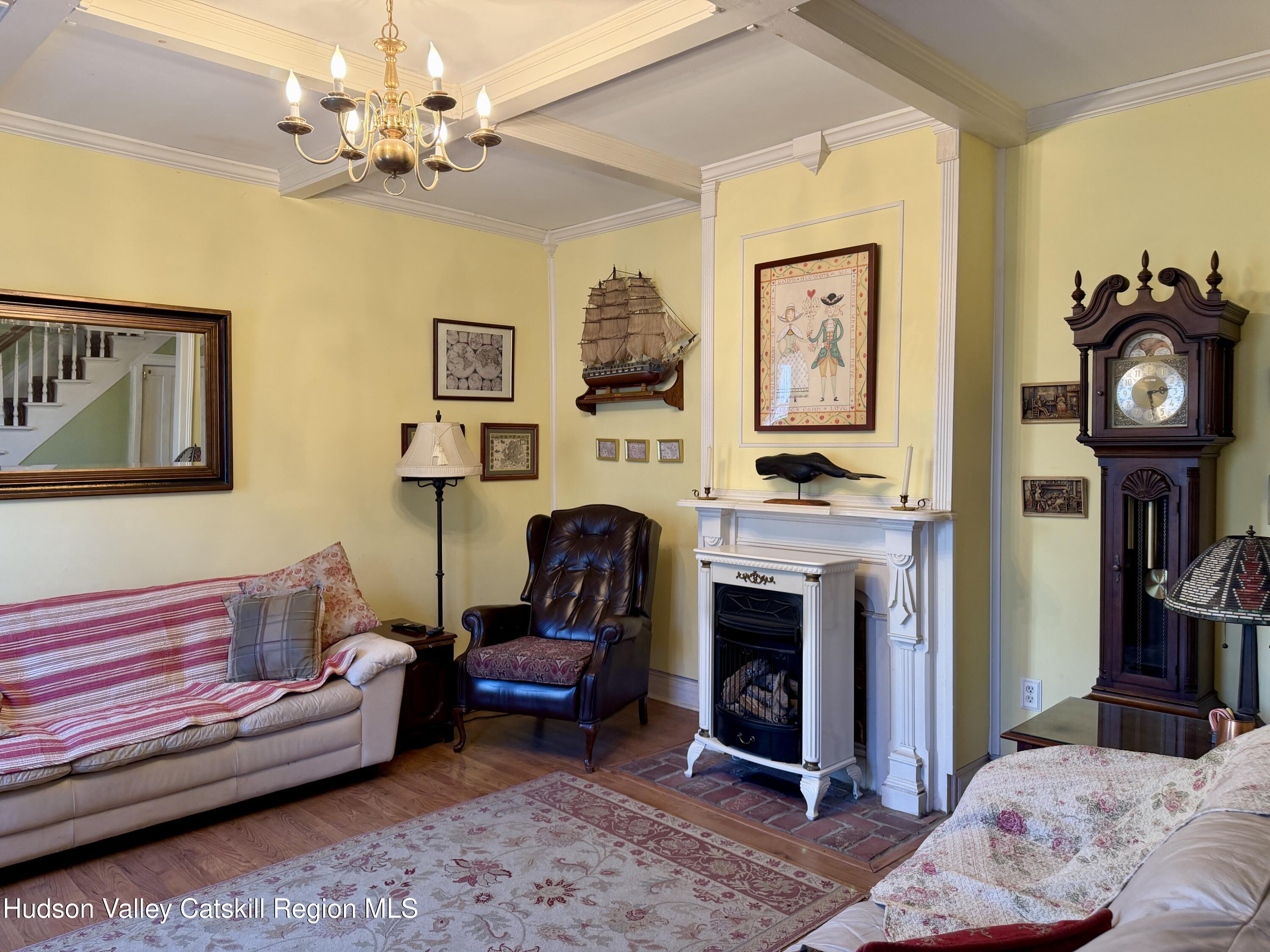 20 8th Street Hudson, NY 12534 - Photo 6 of 29 a living room with furniture and a fireplace