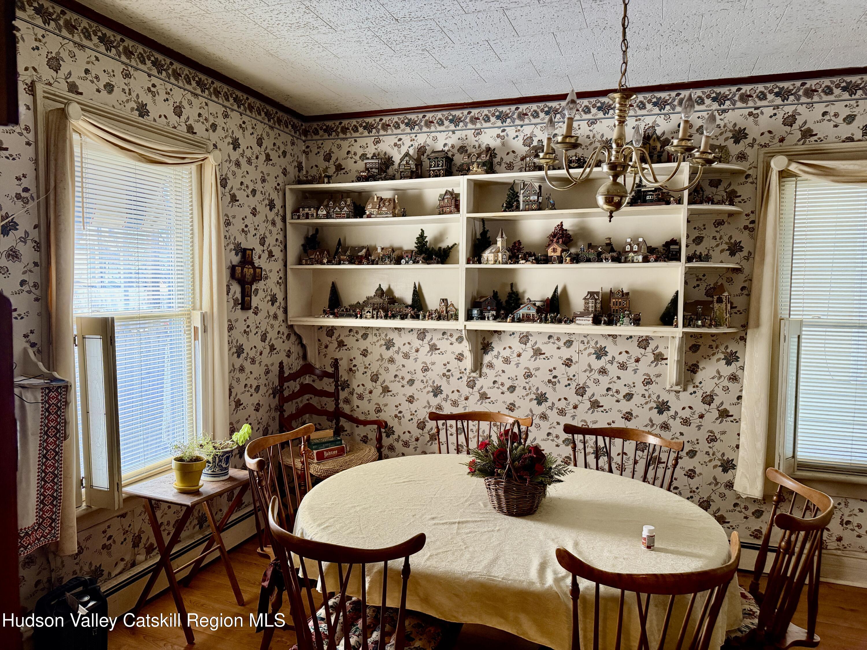 20 8th Street Hudson, NY 12534 - Photo 8 of 29 a view of a dining room with furniture and chandelier