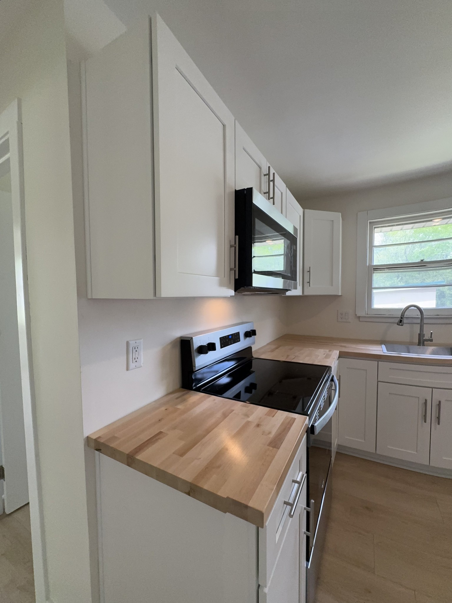 4362 Cato Road Nashville, TN 37218 - Photo 14 of 16 a kitchen with a sink stove and microwave