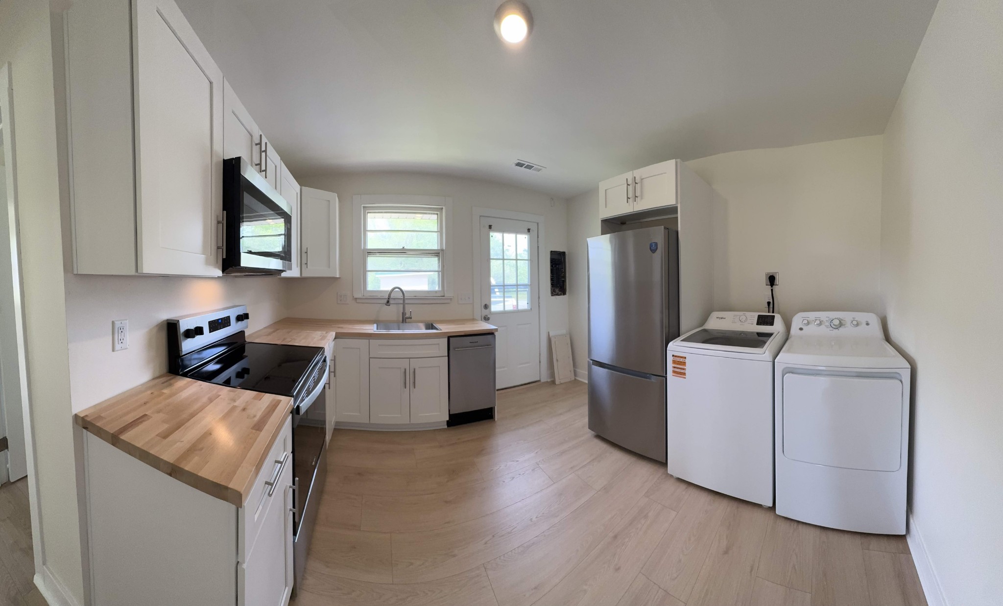 4362 Cato Road Nashville, TN 37218 - Photo 2 of 16 a kitchen with a sink and a stove top oven
