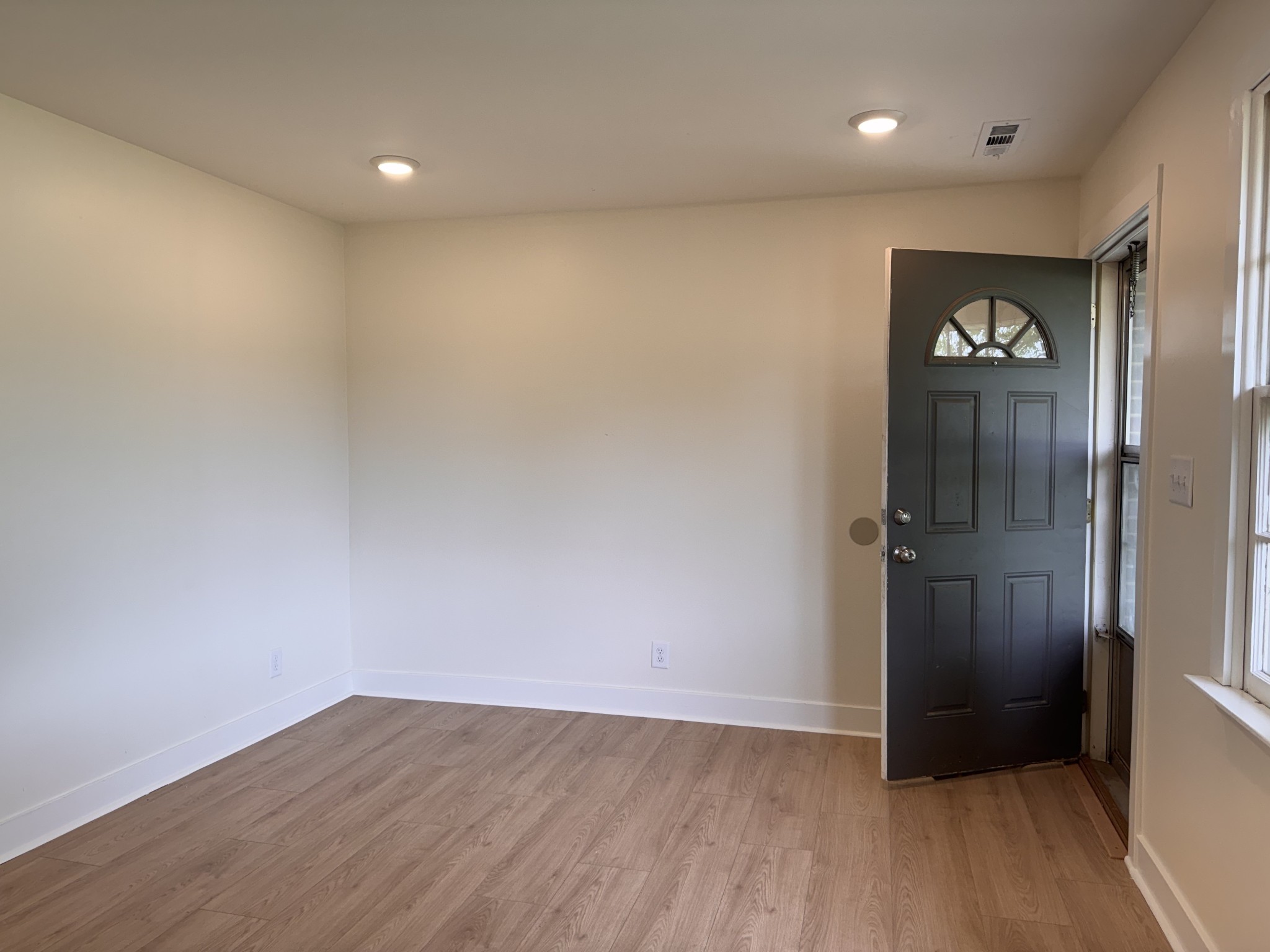 4362 Cato Road Nashville, TN 37218 - Photo 3 of 16 wooden floor in an empty room and a mirror