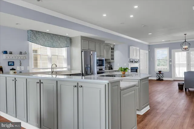 a kitchen with sink and cabinets