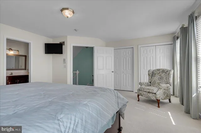 a bedroom with a bed and furniture