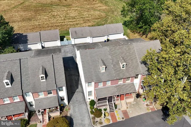 an aerial view of a house with outdoor space