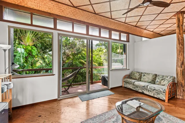 a patio view with a glass table and a floor to ceiling window