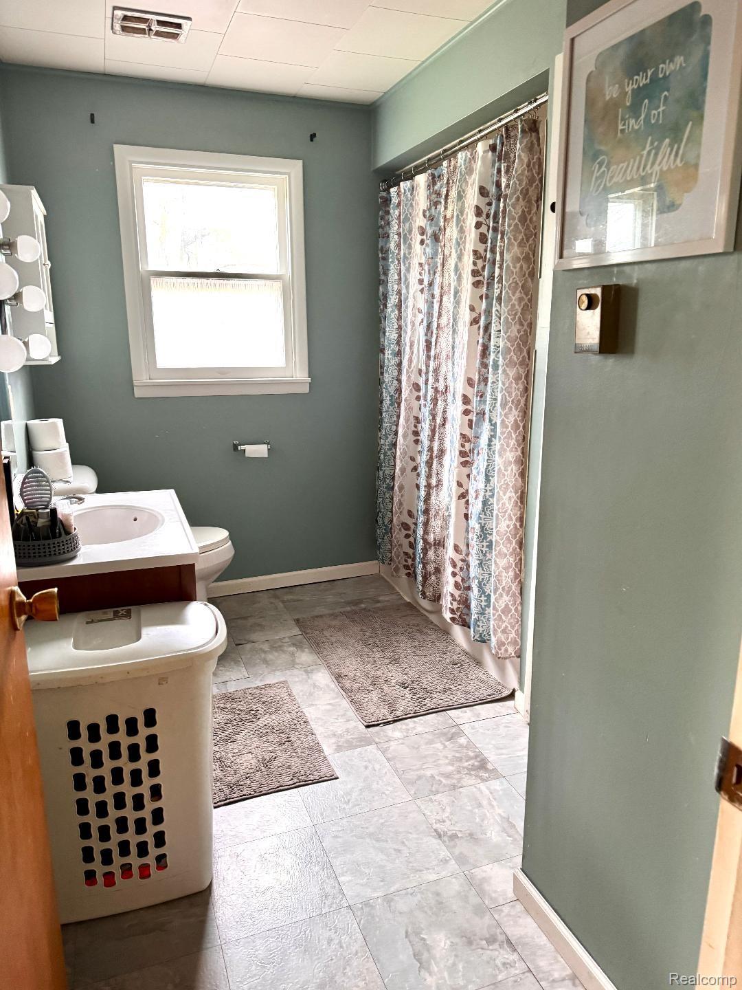687 West Saginaw Road Mayville, MI 48744 - Photo 5 of 12 Bathroom with a shower with curtain and vanity