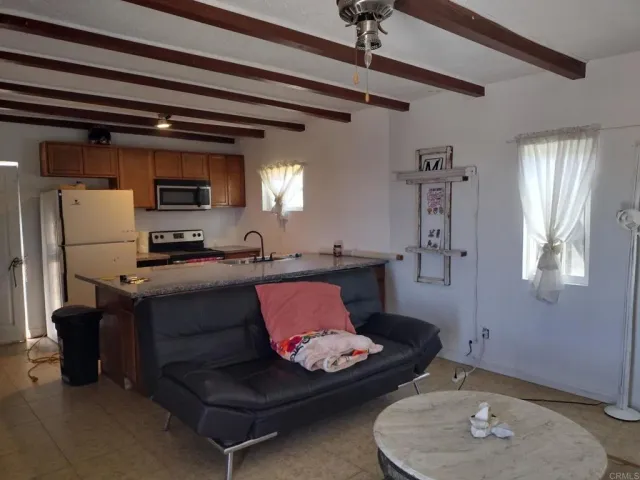 a living room with furniture and a window