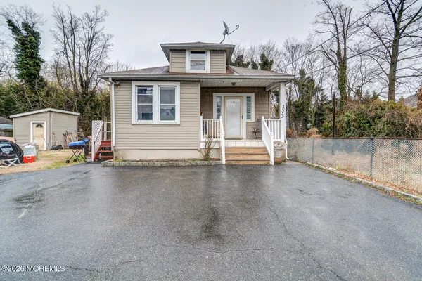 a view of a house with basket ball court