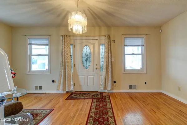 a bedroom with bed and a window