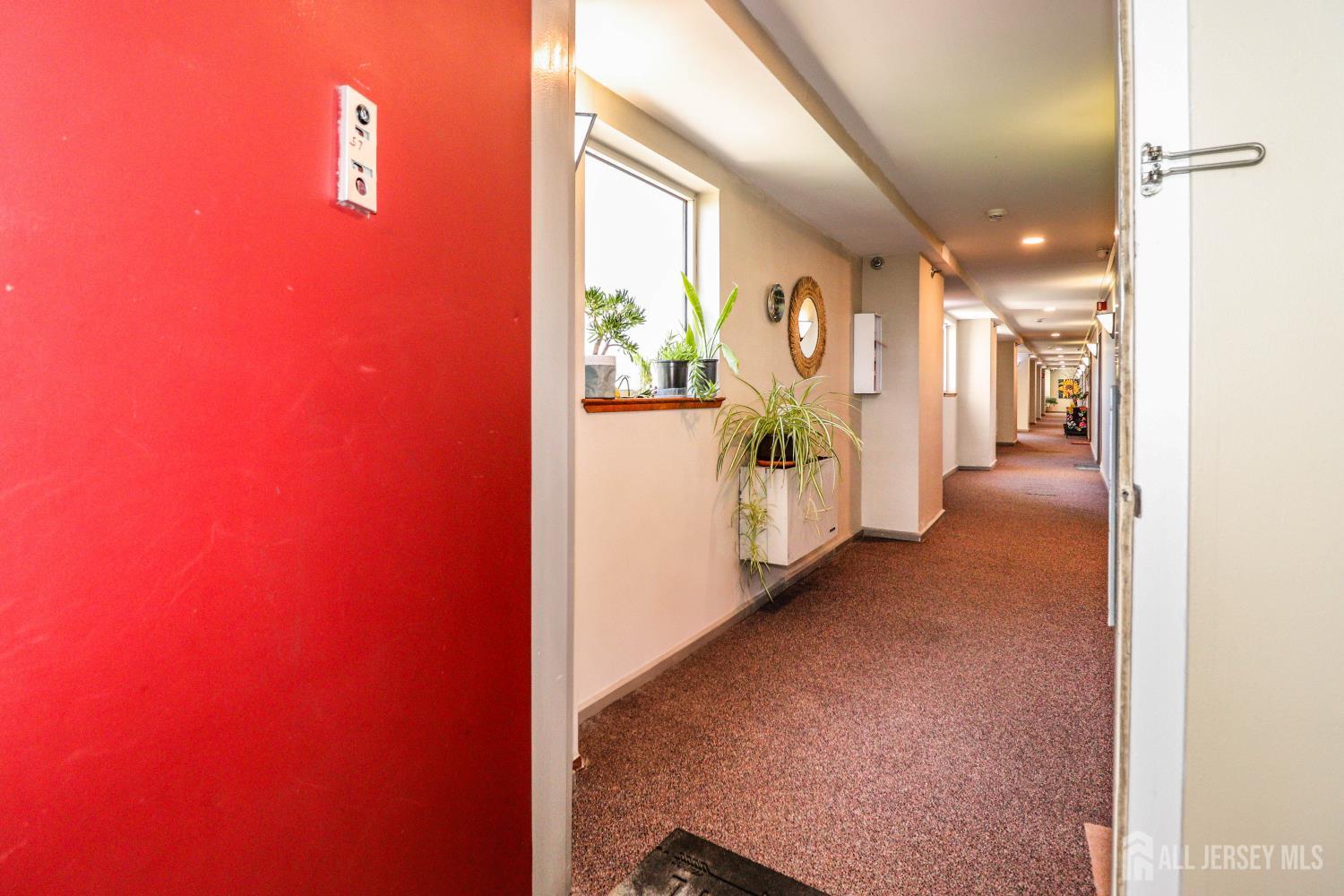 40 Fayette Street, Unit 57 Perth Amboy, NJ 08861 - Photo 3 of 33 a view of a hallway with wooden floor