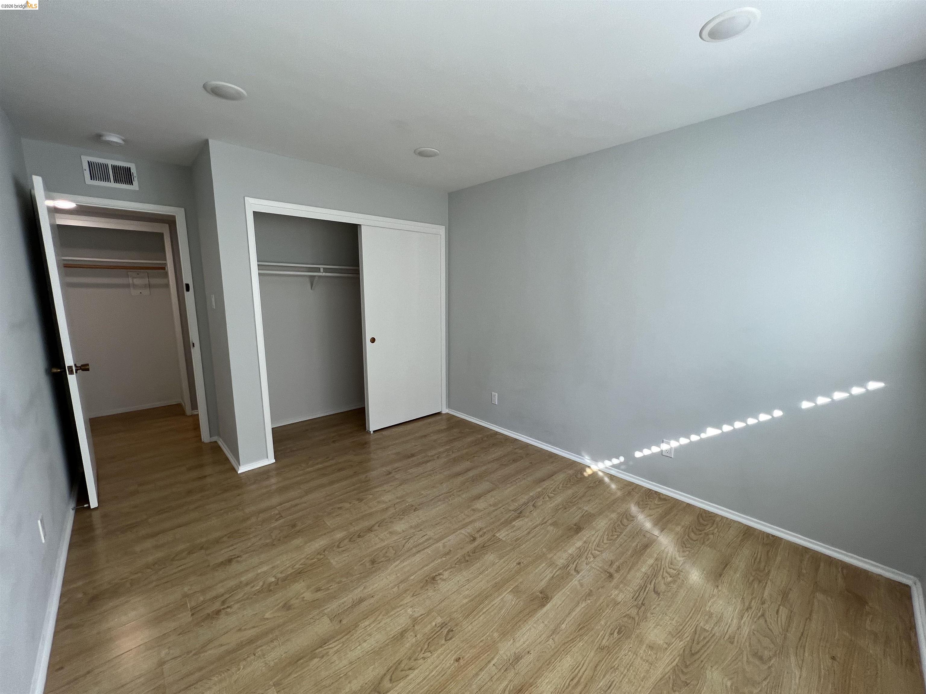 2636 Warring Street, Unit 204 Berkeley, CA 94704 - Photo 5 of 10 a view of empty room with wooden floor