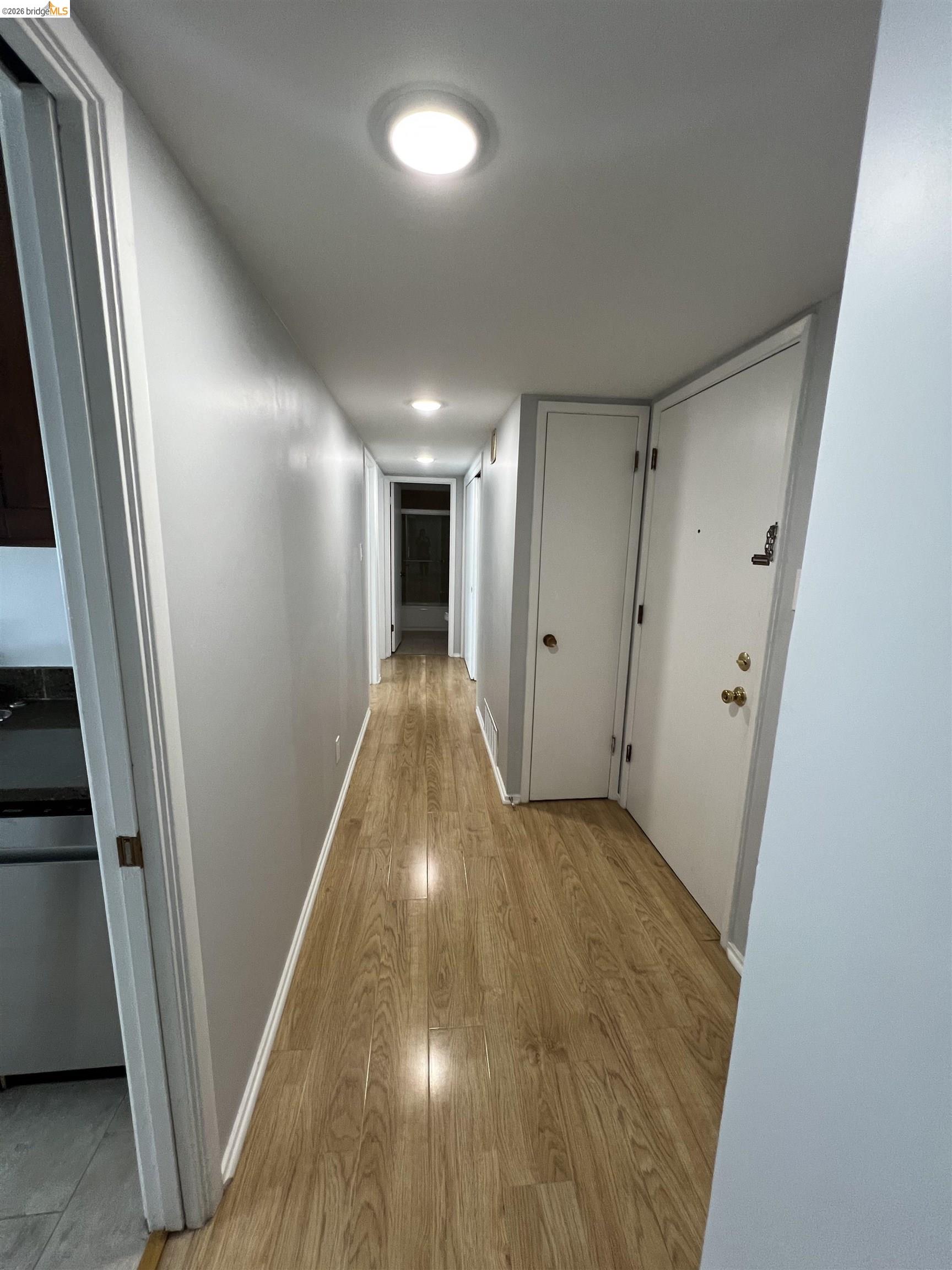 2636 Warring Street, Unit 204 Berkeley, CA 94704 - Photo 6 of 10 a view of a hallway with wooden floor