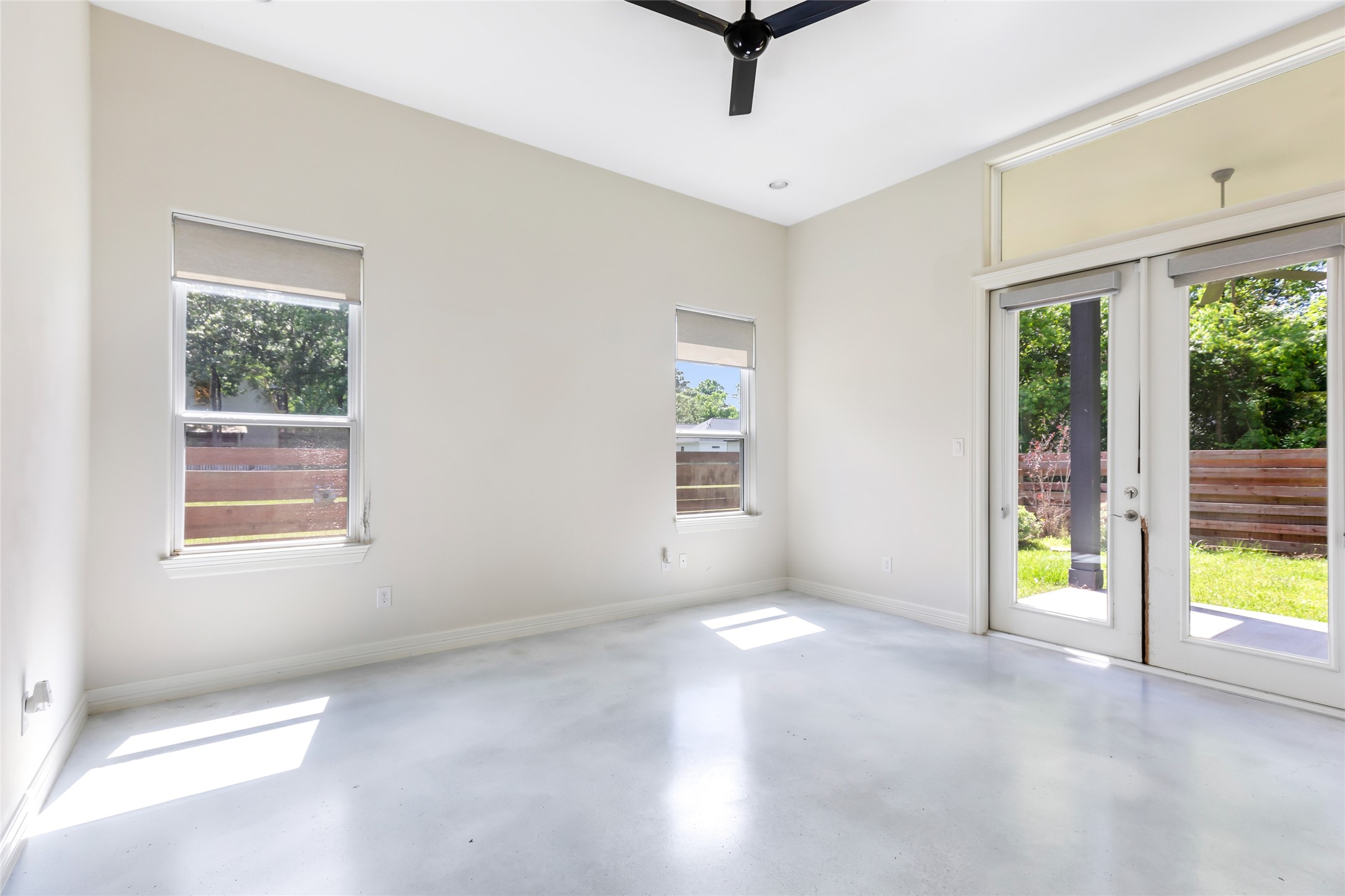 538 Magnolia Point Drive Huffman, TX 77336 - Photo 12 of 30 Master bedroom with access to covered back patio. High ceilings, recessed lighting and stained concrete floors