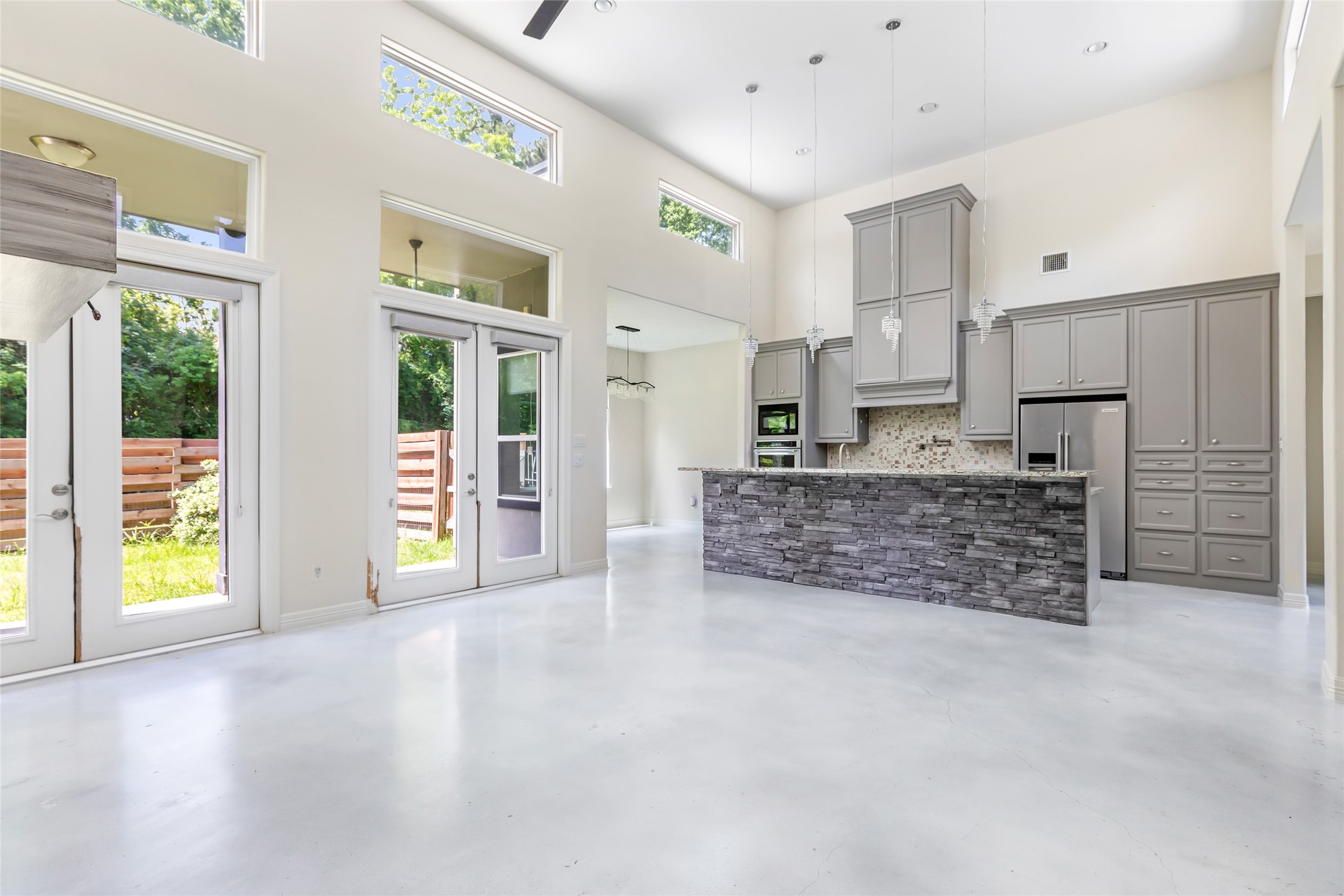 538 Magnolia Point Drive Huffman, TX 77336 - Photo 29 of 30 Natural light, high ceilings, stained concrete and an open floor plan