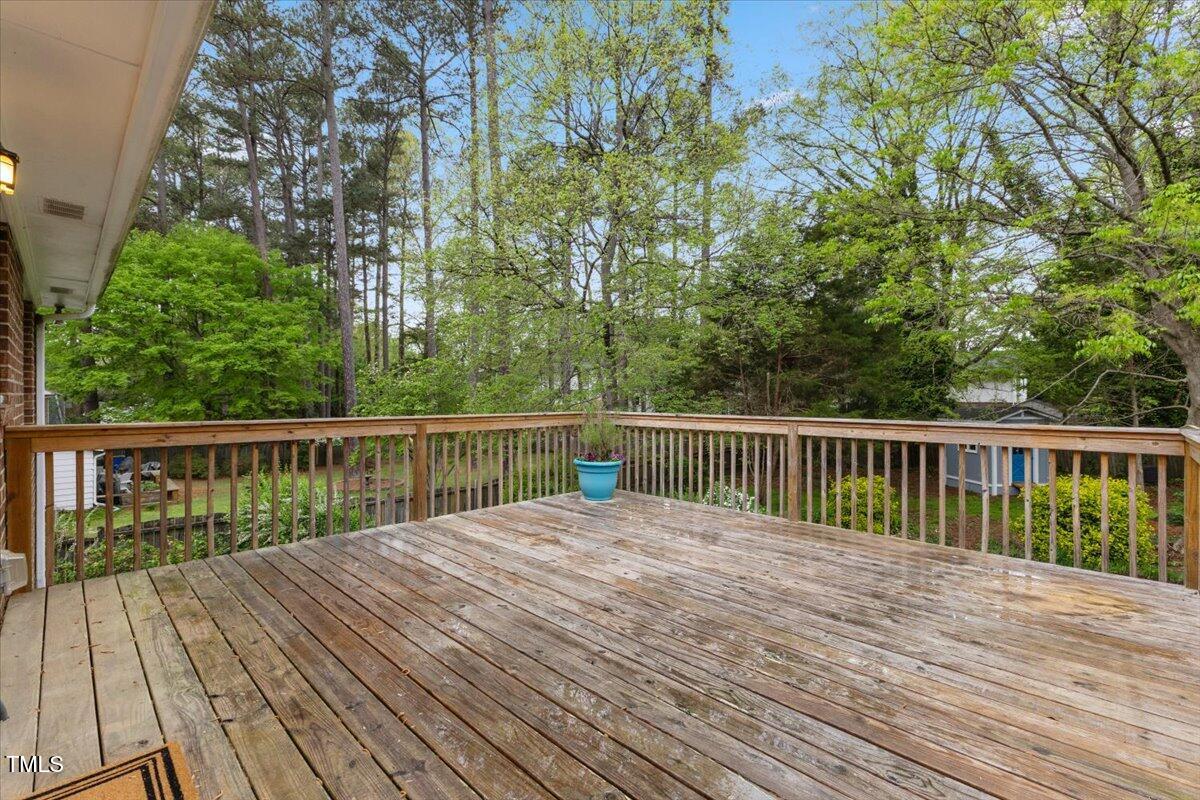1205 Country Ridge Drive Raleigh, NC 27609 - Photo 53 of 73 a balcony with view of trees in front of it