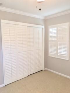 159 Stillwater Circle Jupiter, FL 33458 - Photo 18 of 27 Bedroom 2 w/plantation shutters