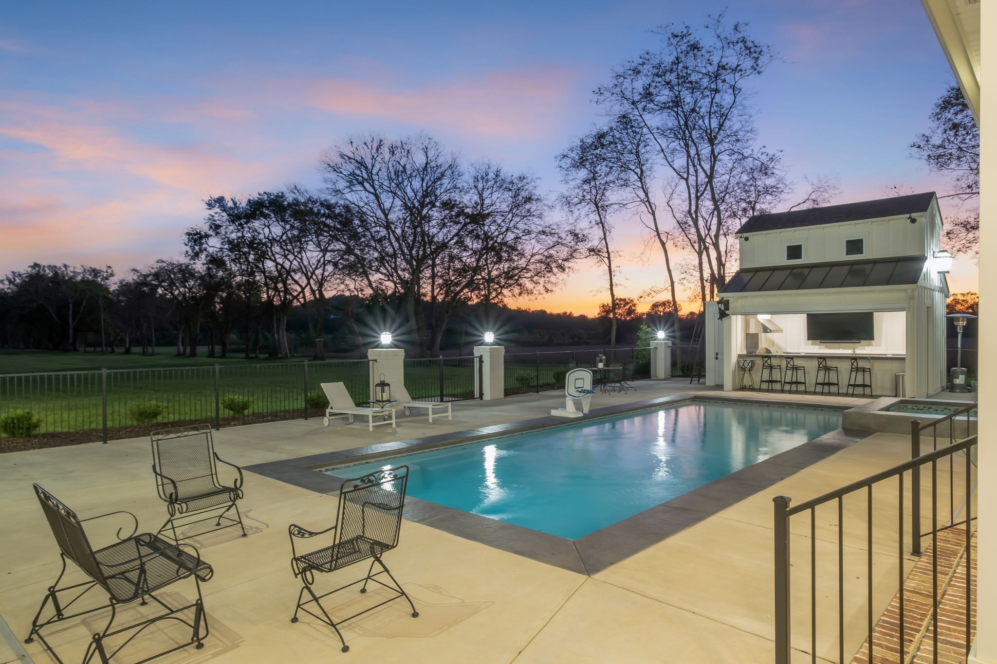 4855 Murfreesboro Road Arrington, TN 37014 - Photo 17 of 63 a view of a swimming pool with a table and chairs