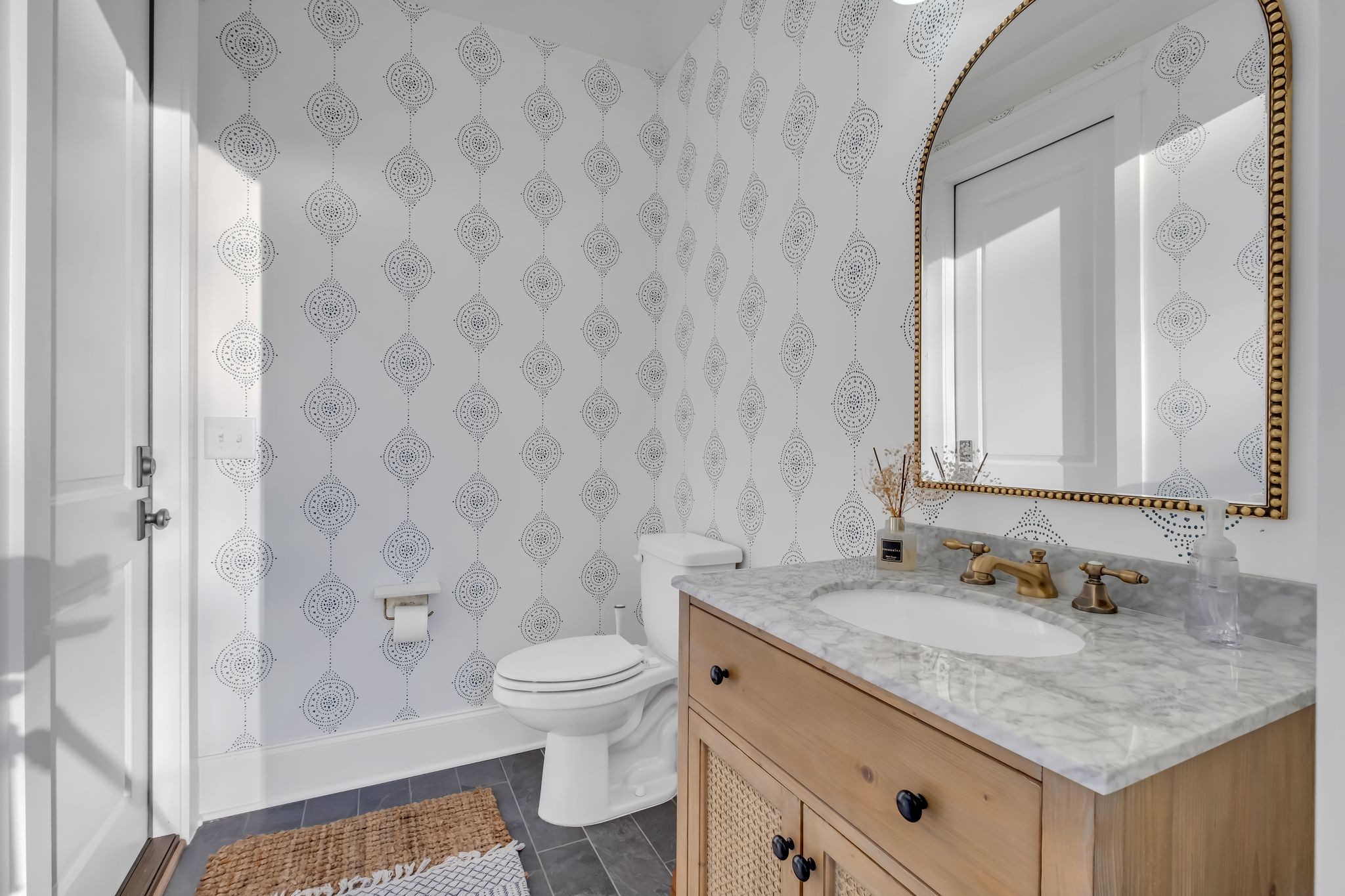 4855 Murfreesboro Road Arrington, TN 37014 - Photo 30 of 63 a bathroom with a granite countertop sink a toilet and a mirror
