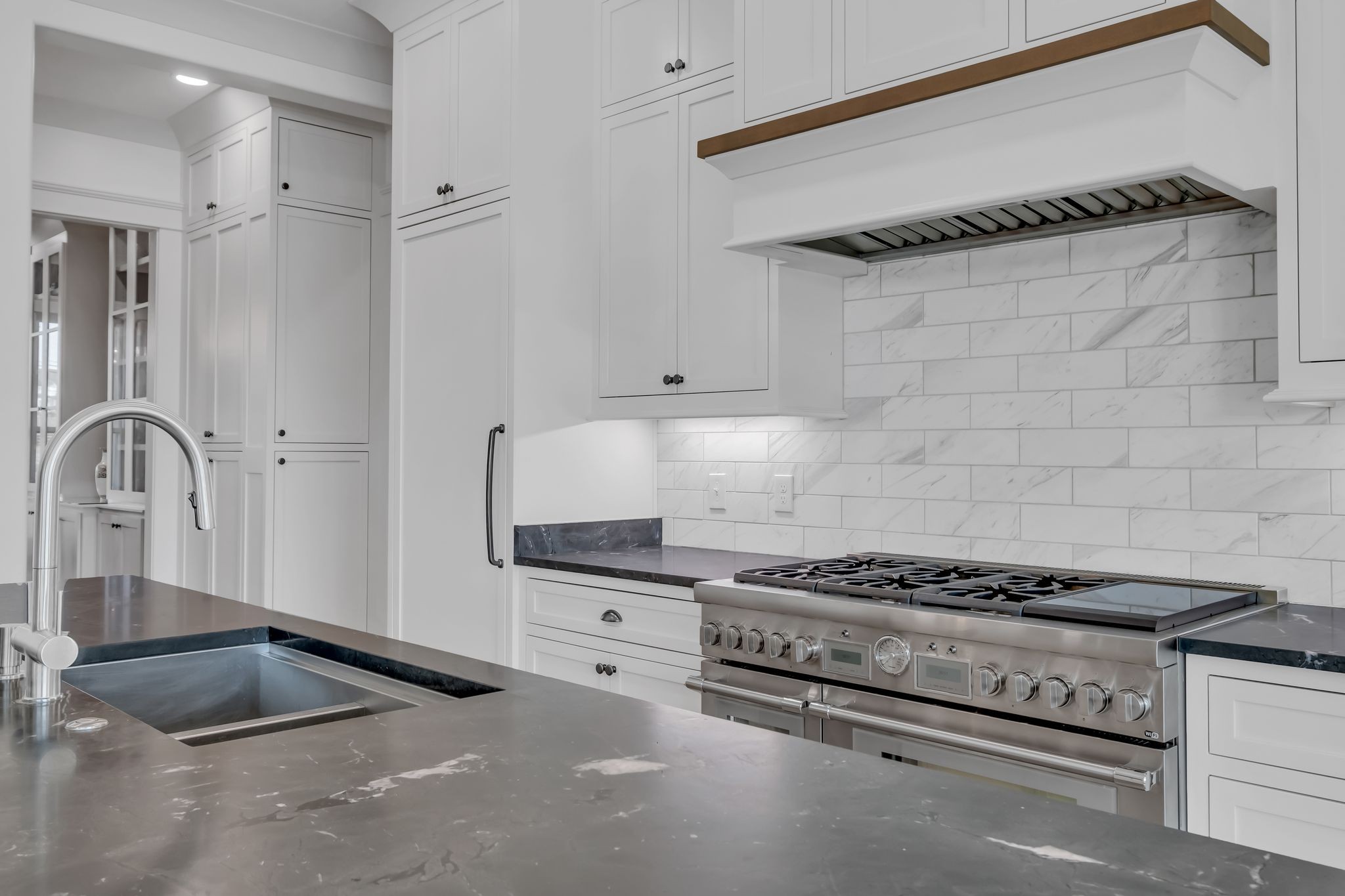 4855 Murfreesboro Road Arrington, TN 37014 - Photo 33 of 63 a kitchen with granite countertop a stove and a sink