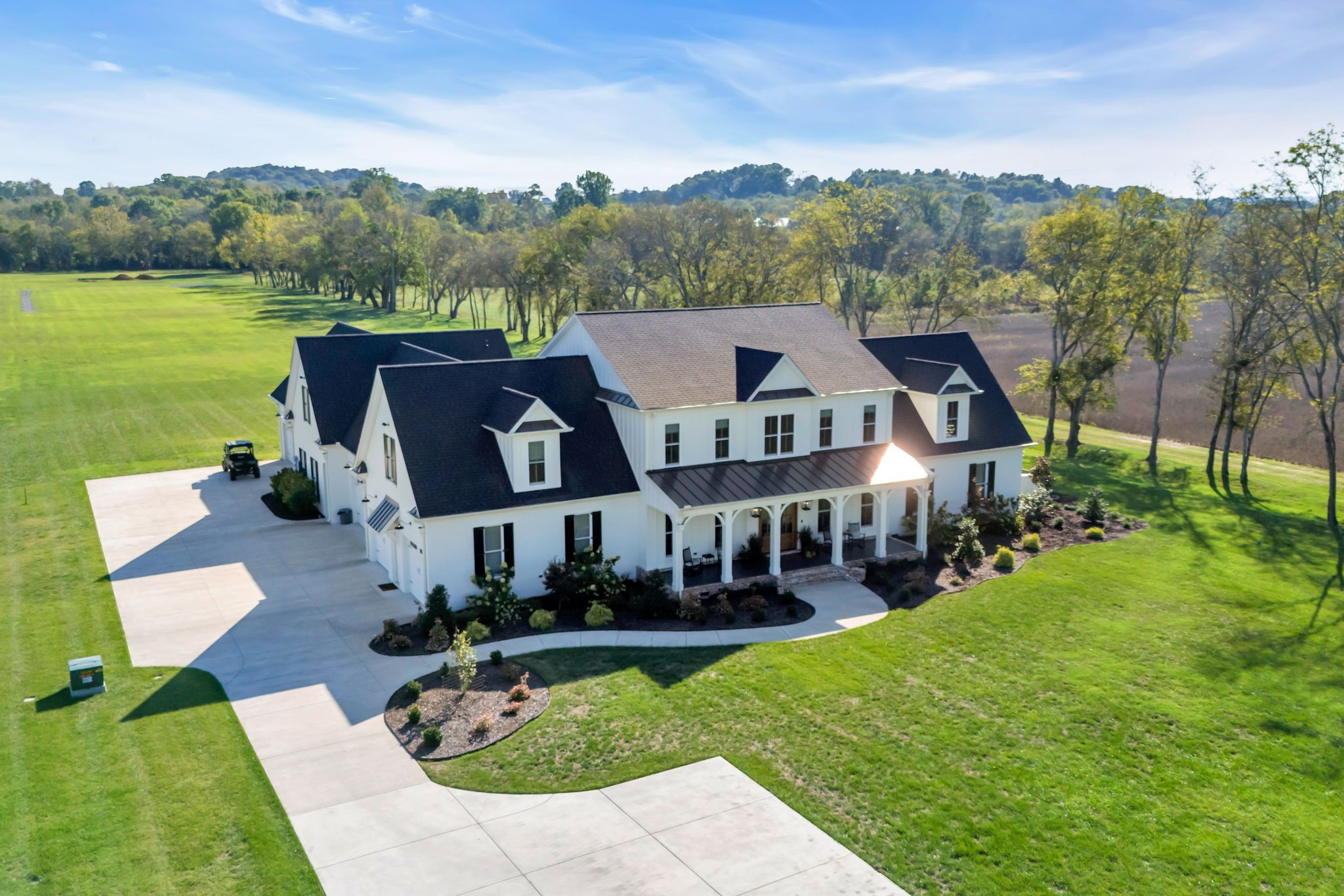 4855 Murfreesboro Road Arrington, TN 37014 - Photo 5 of 63 a view of a big house with a big yard and large trees