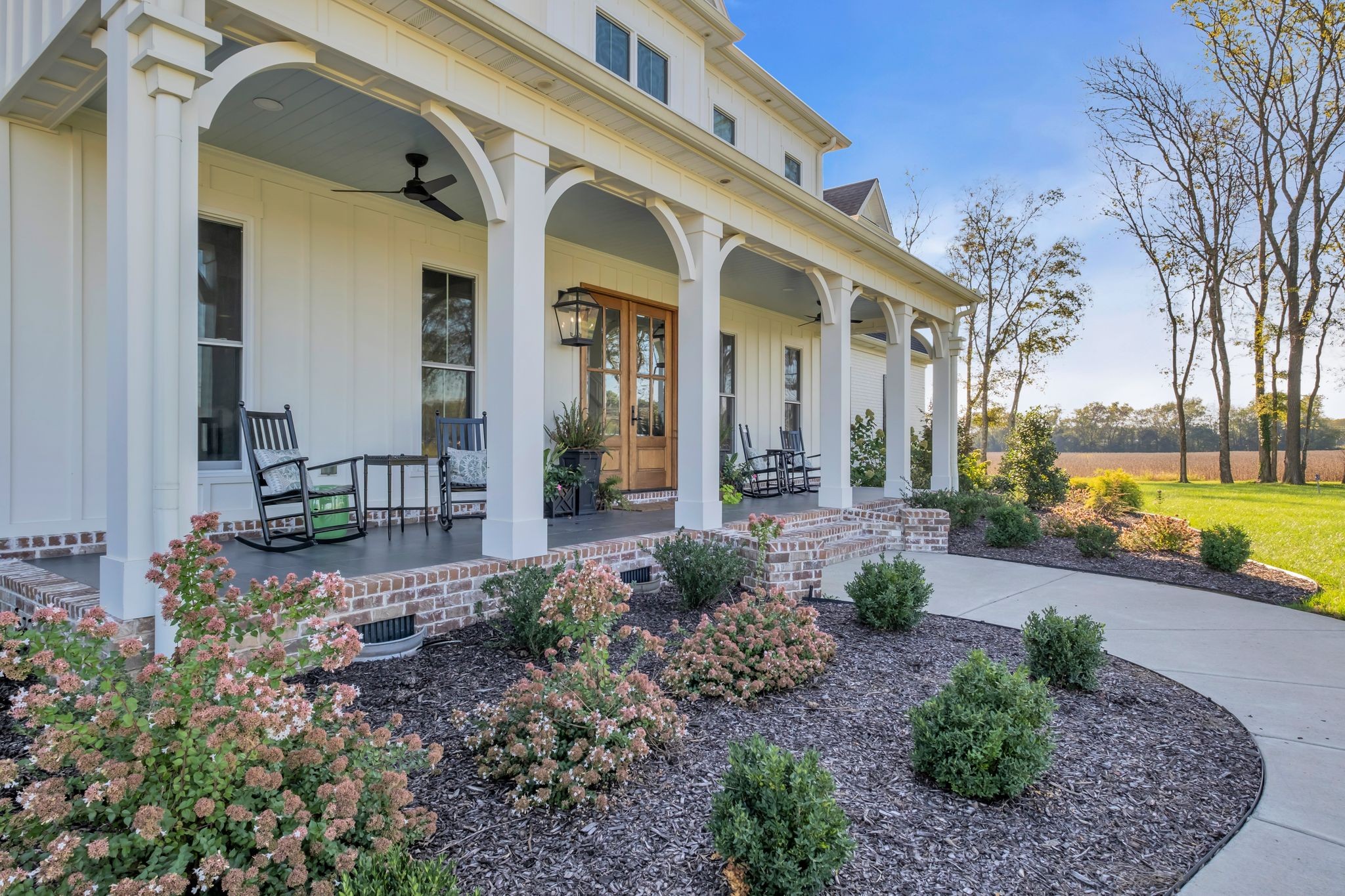 4855 Murfreesboro Road Arrington, TN 37014 - Photo 8 of 63 a view of a patio with table and chairs potted plants and large tree