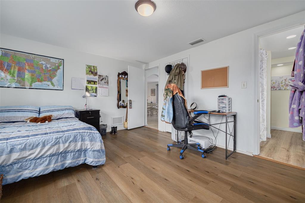 3322 Fairmount Drive Holiday, FL 34691 - Photo 15 of 29 a bedroom that has a bed and a chair in it