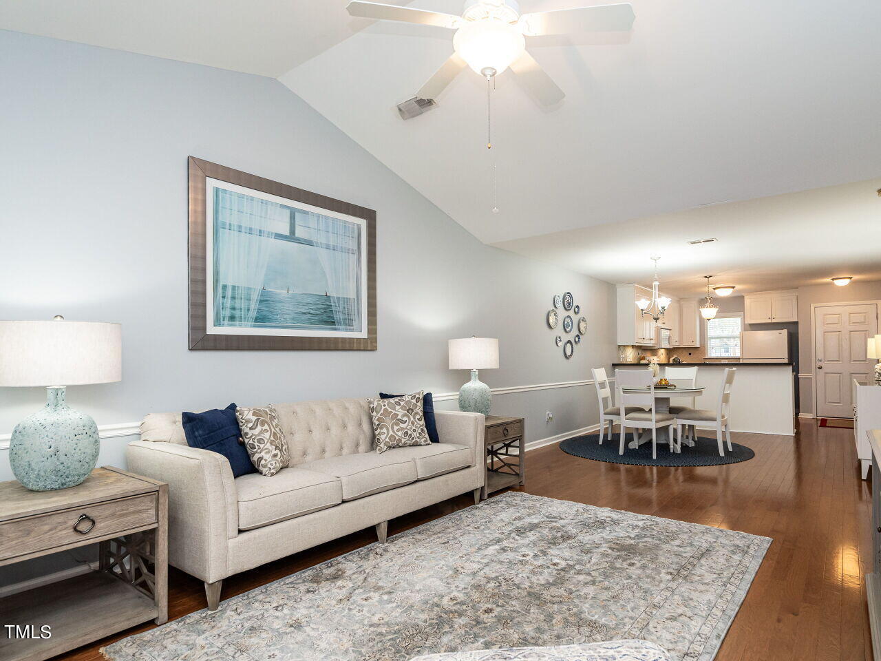 585 Pinecroft Drive Clayton, NC 27520 - Photo 12 of 26 a living room with furniture wooden floor and a lamp
