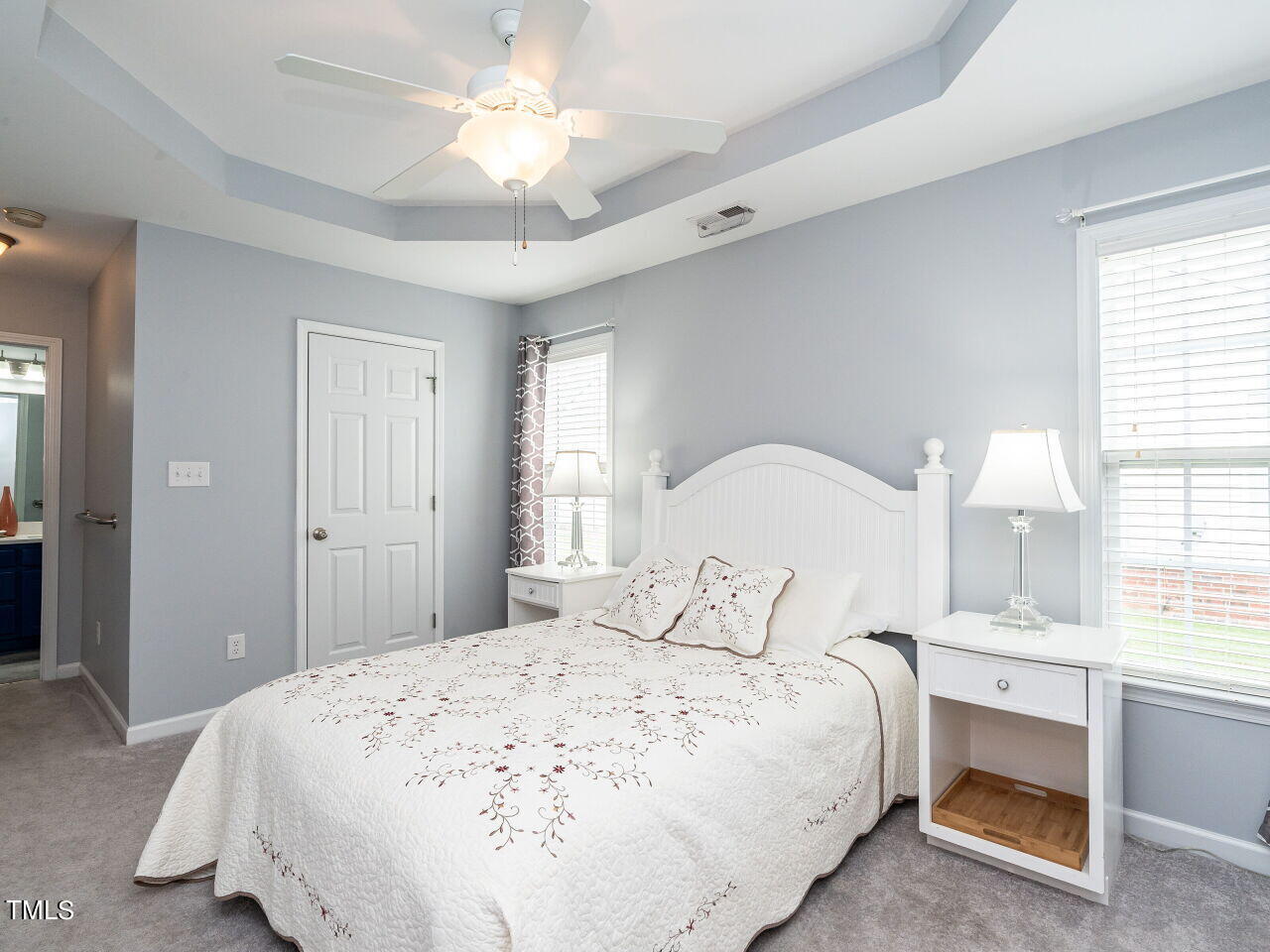 585 Pinecroft Drive Clayton, NC 27520 - Photo 15 of 26 a bedroom with a bed and a window