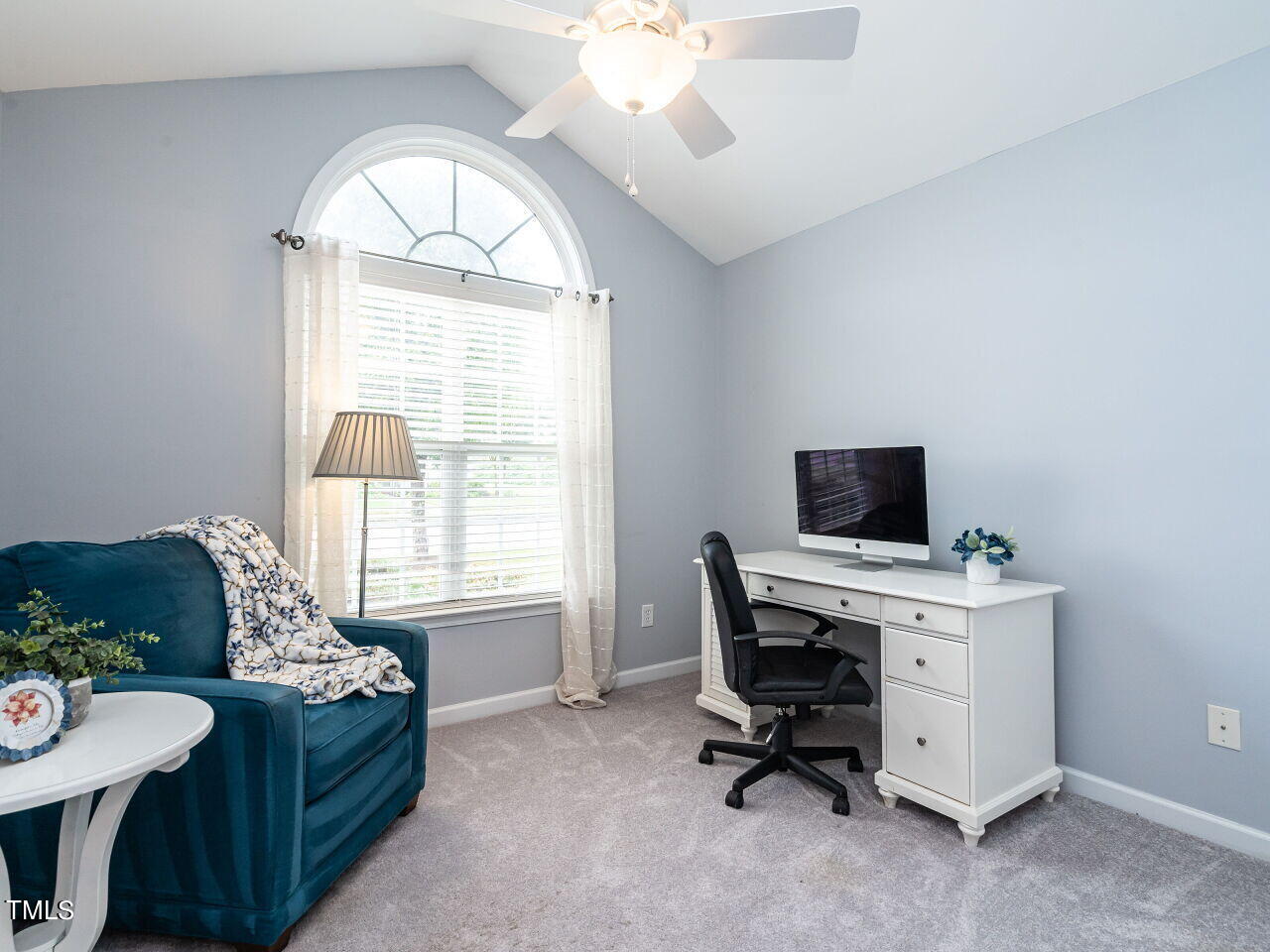 585 Pinecroft Drive Clayton, NC 27520 - Photo 17 of 26 a view of a workspace with furniture and a window