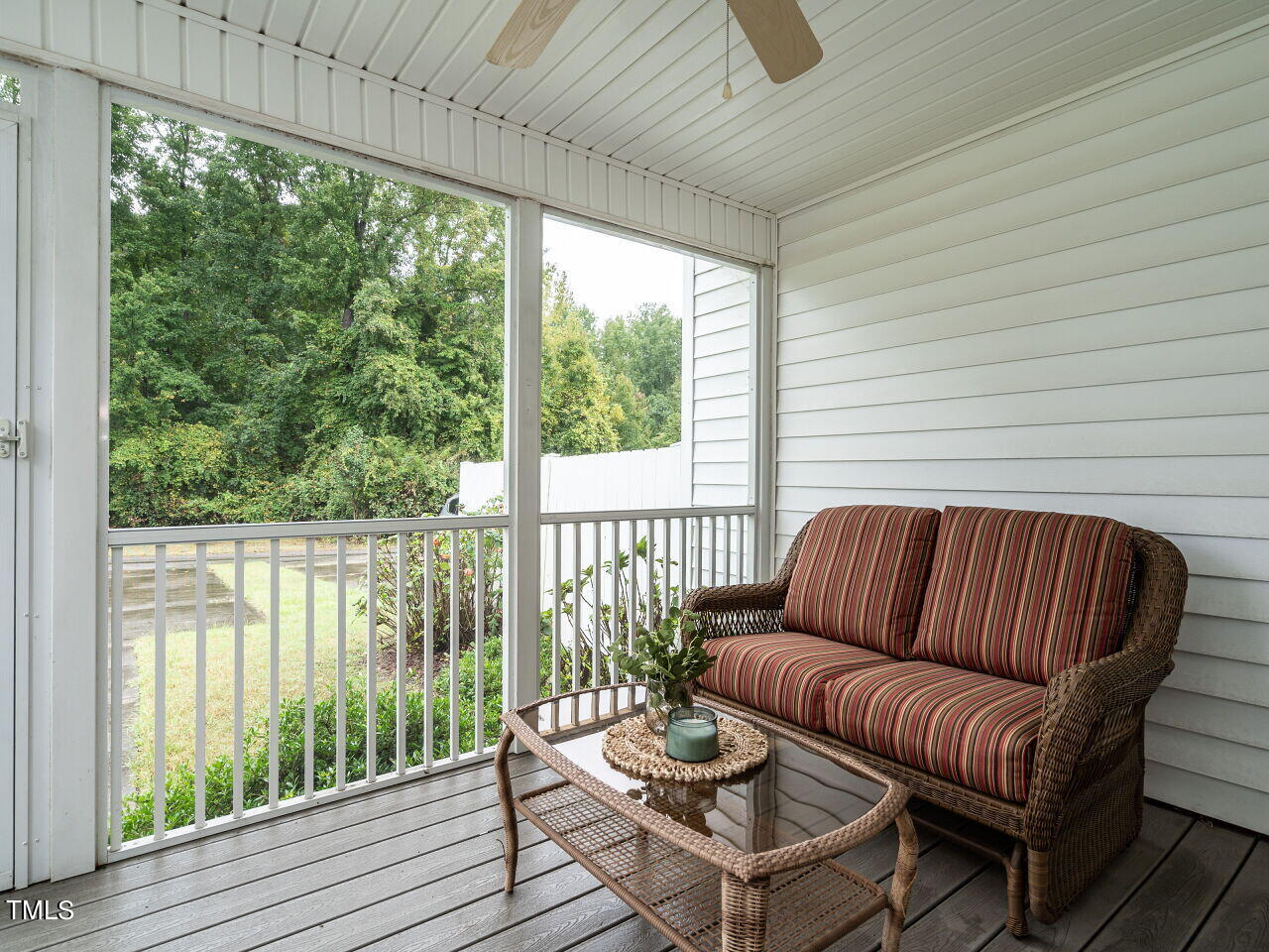 585 Pinecroft Drive Clayton, NC 27520 - Photo 21 of 26 a living room with furniture and a floor to ceiling window