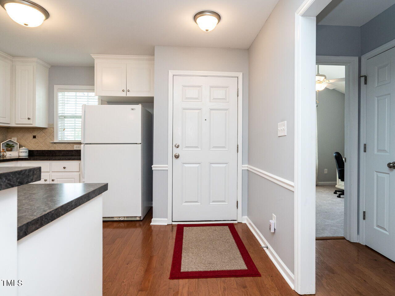 585 Pinecroft Drive Clayton, NC 27520 - Photo 3 of 26 a kitchen with a refrigerator and a sink